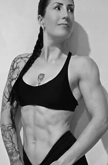 Muscular person posing in athletic wear.